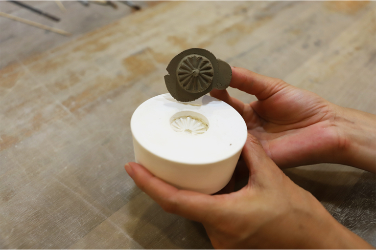 Inside of a bustling Japanese dessert shop with a display of mochi, dorayaki, and matcha latte